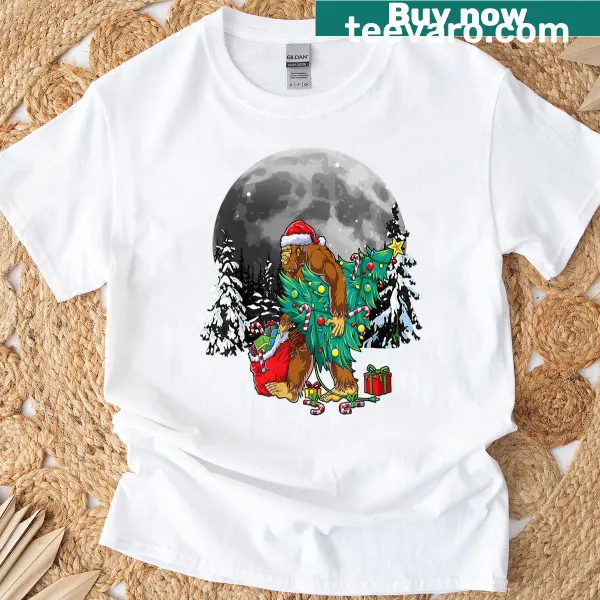 Humorous Bigfoot graphic tangled in Christmas lights T-shirt