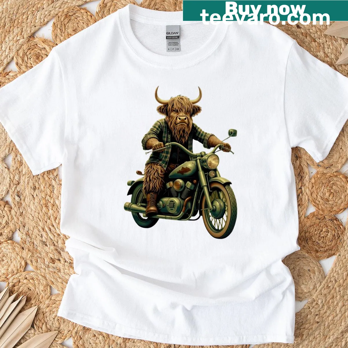 Highland cow riding motorcycle graphic T-shirt — on a men's t-shirt