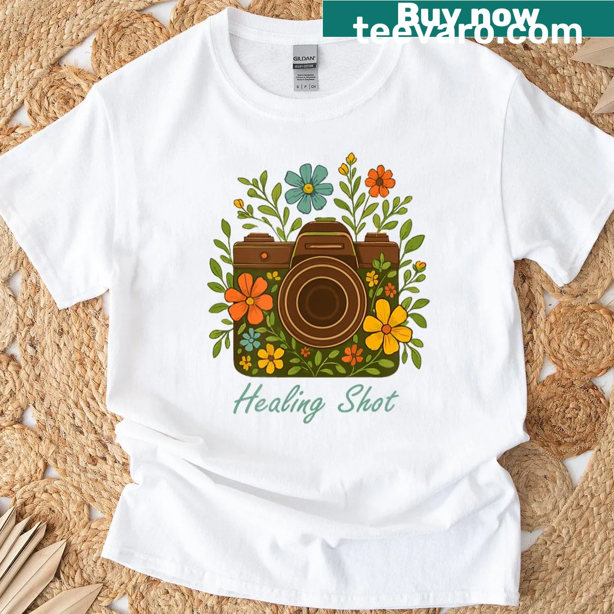 Camera surrounded by flowers, symbolizing mental health and photography. — on a men's t-shirt