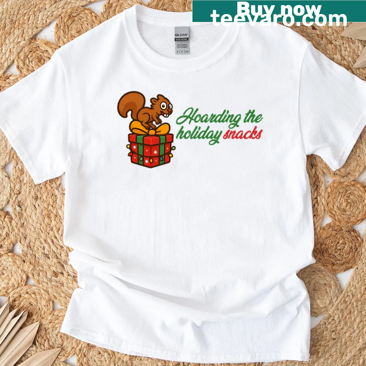 Funny Christmas T-shirt with a squirrel hoarding holiday snacks in a playful illustration — on a men's t-shirt