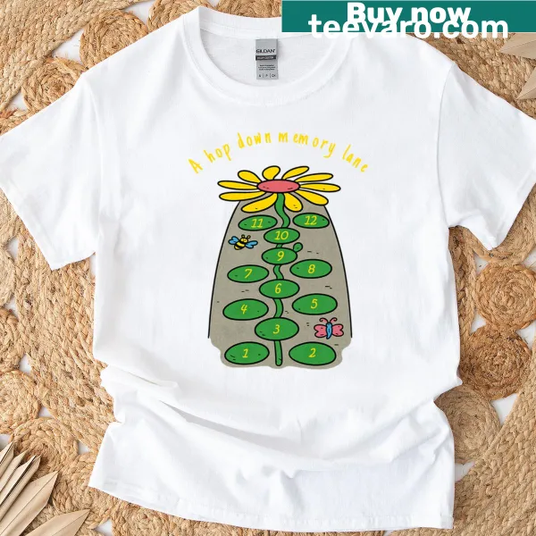 T-shirt featuring a nostalgic hopscotch design reminiscent of childhood.