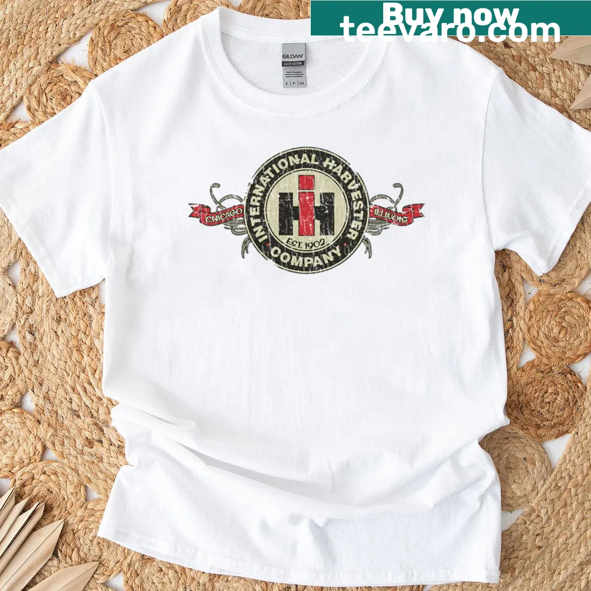 Vintage t-shirt featuring the International Harvester Company 1902 logo — on a men's t-shirt