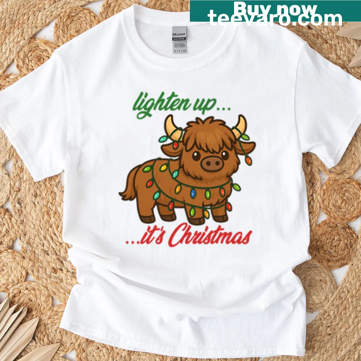 Charming Christmas T-shirt with a Highland cow and the phrase 'Lighten Up It's Christmas' — on a men's t-shirt