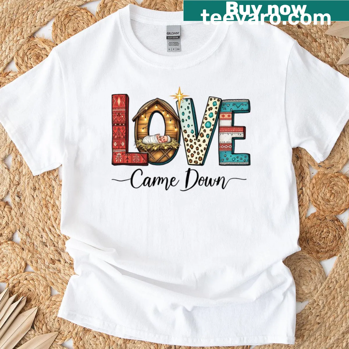 Nativity scene graphic featuring Baby Jesus and manger design — on a men's t-shirt