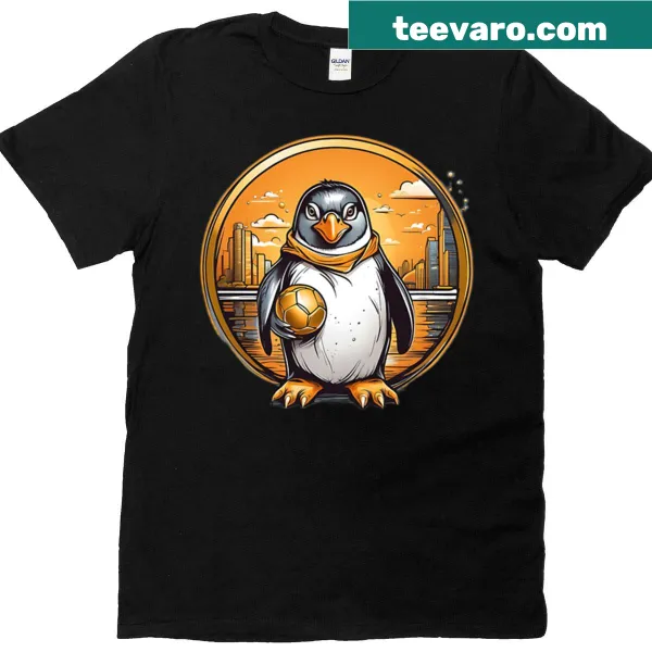 Cute T-shirt featuring a penguin playing with a golden ball