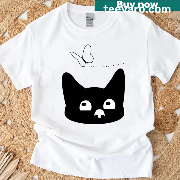 T-shirt with a playful black and white cat and butterfly illustration