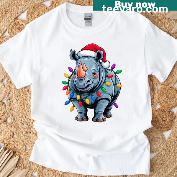 Funny Christmas T-shirt featuring a rhino in a Santa hat with holiday lights