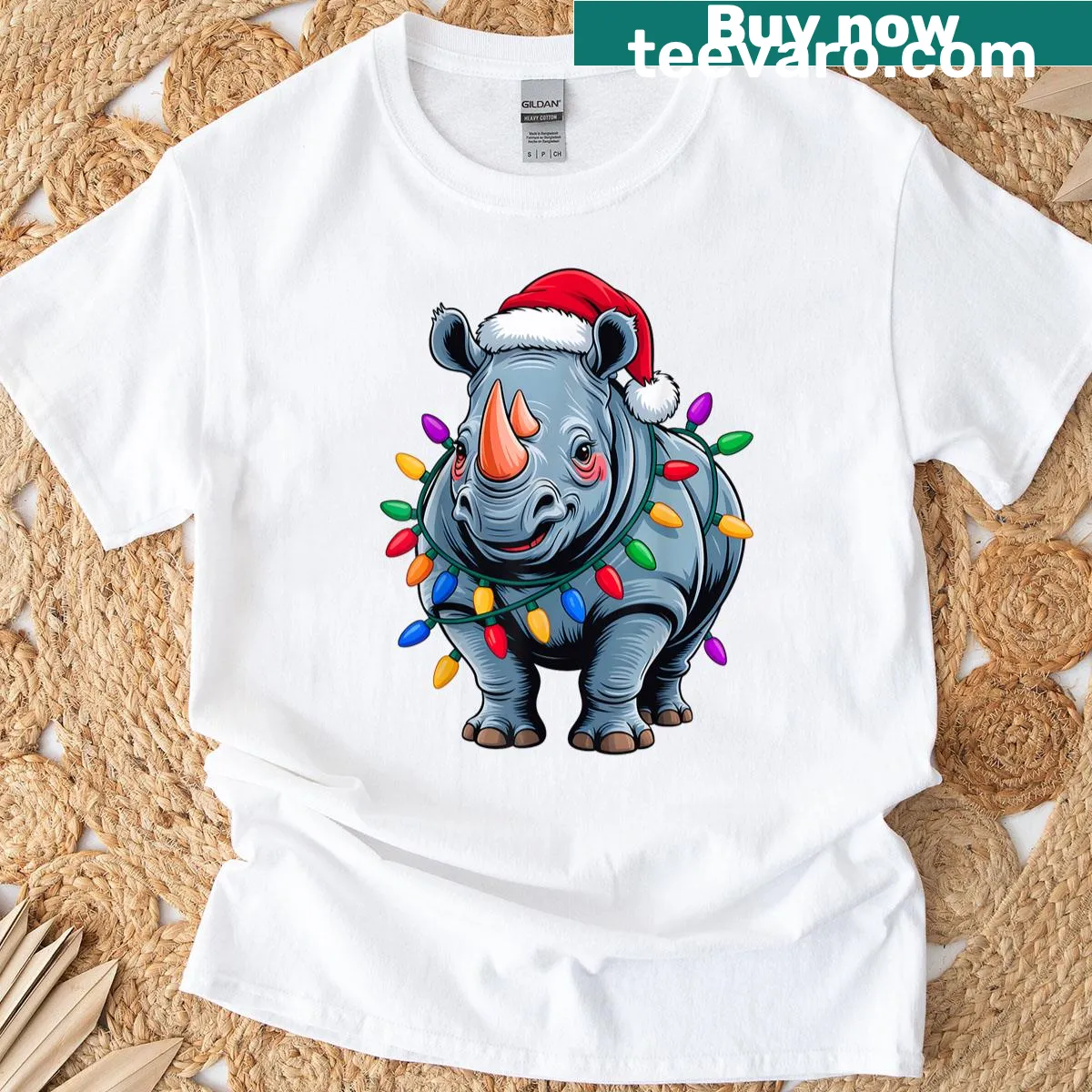 Funny Christmas T-shirt featuring a rhino in a Santa hat with holiday lights — on a men's t-shirt