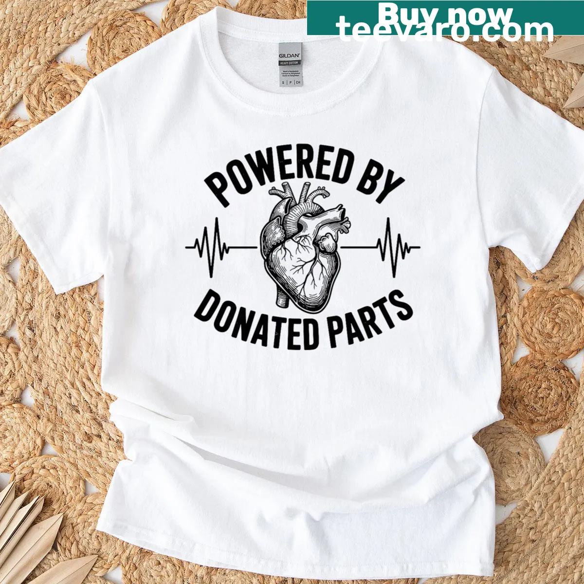 Inspirational T-shirt stating 'Powered By Donated Parts' for heart transplant awareness — on a men's t-shirt
