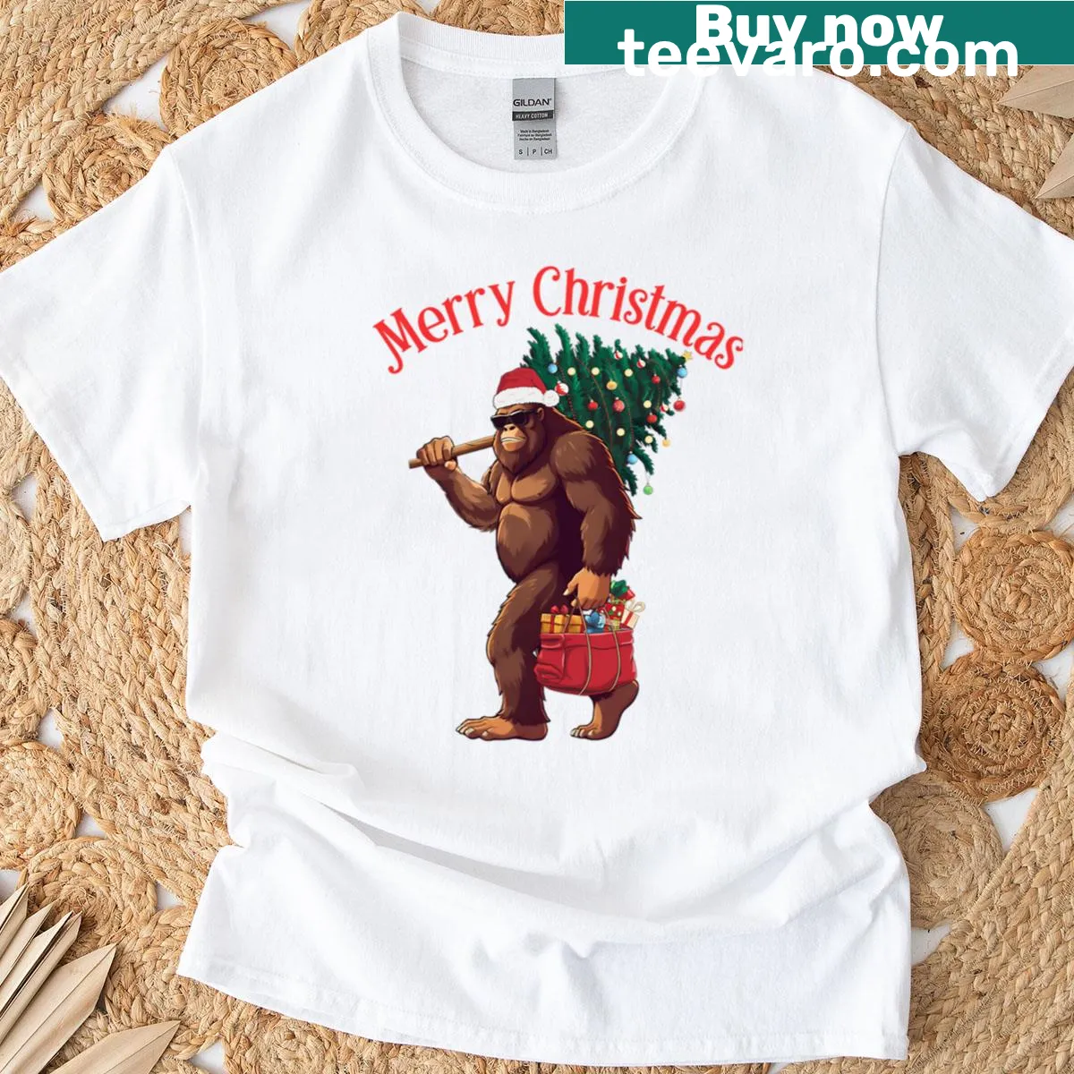 Retro Bigfoot graphic with holiday lights on a Christmas tree T-shirt. — on a men's t-shirt