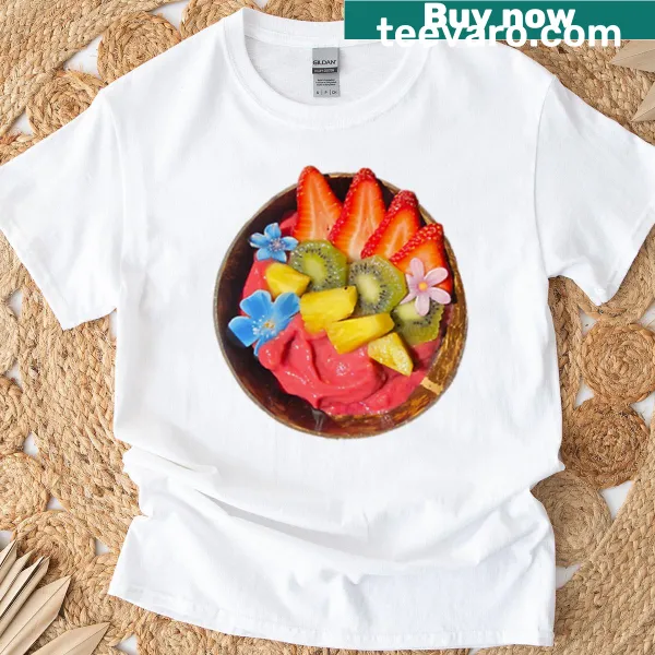 Illustrated pink dragon lounging in a bowl on a t-shirt