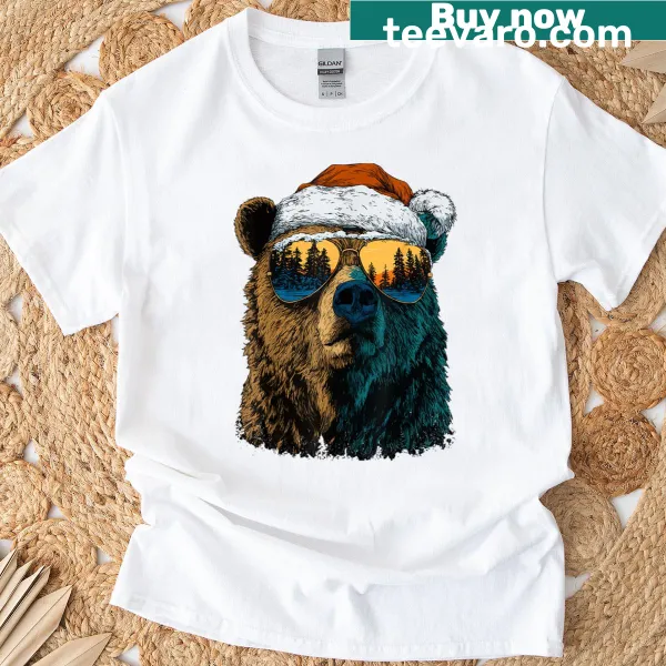Cute bear in sunglasses and Santa hat on a snowy Christmas t-shirt