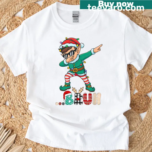 Cartoon dabbing elf graphic on a Christmas t-shirt for kids
