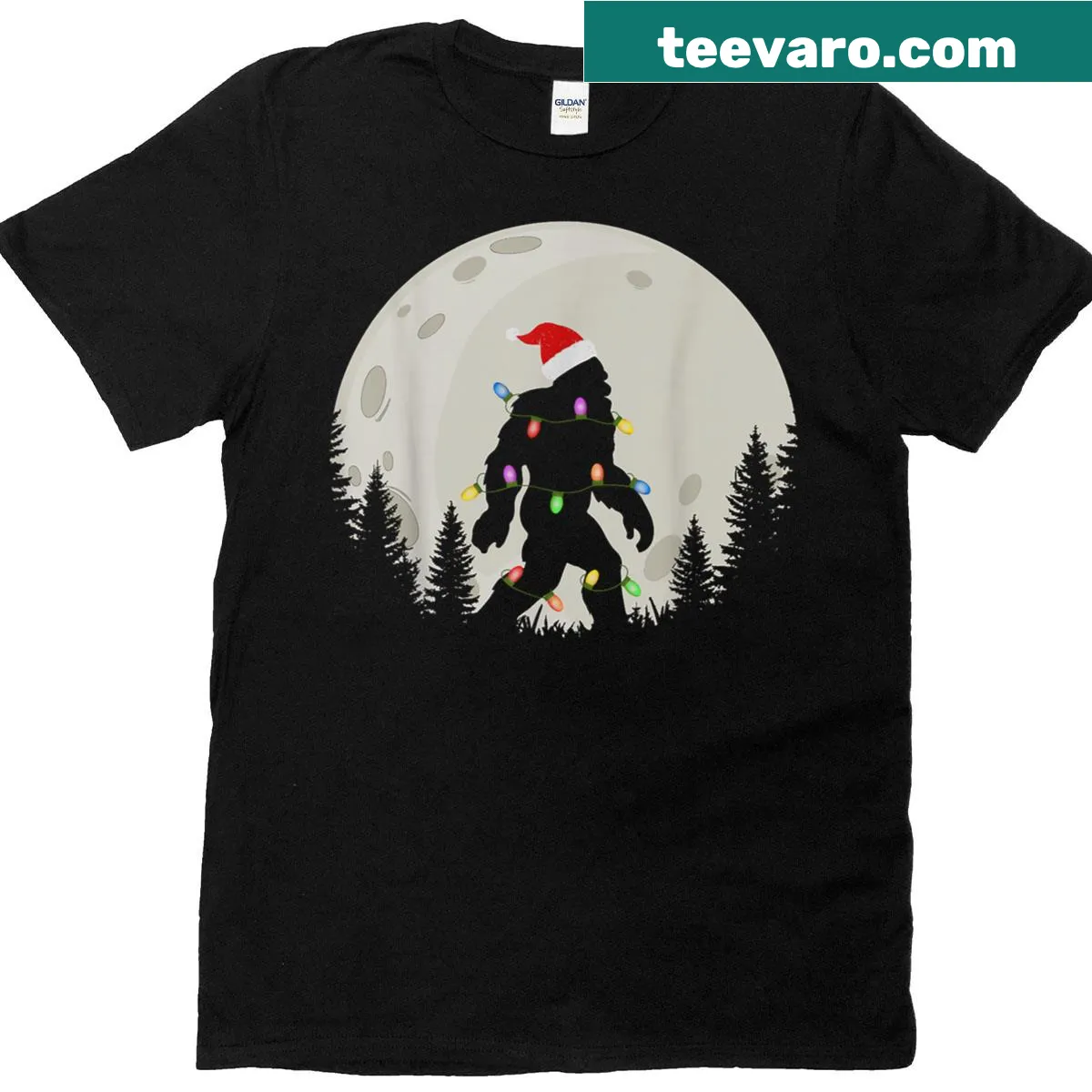 Funny Christmas t-shirt featuring Sasquatch in a Santa hat under the moon — on a men's t-shirt