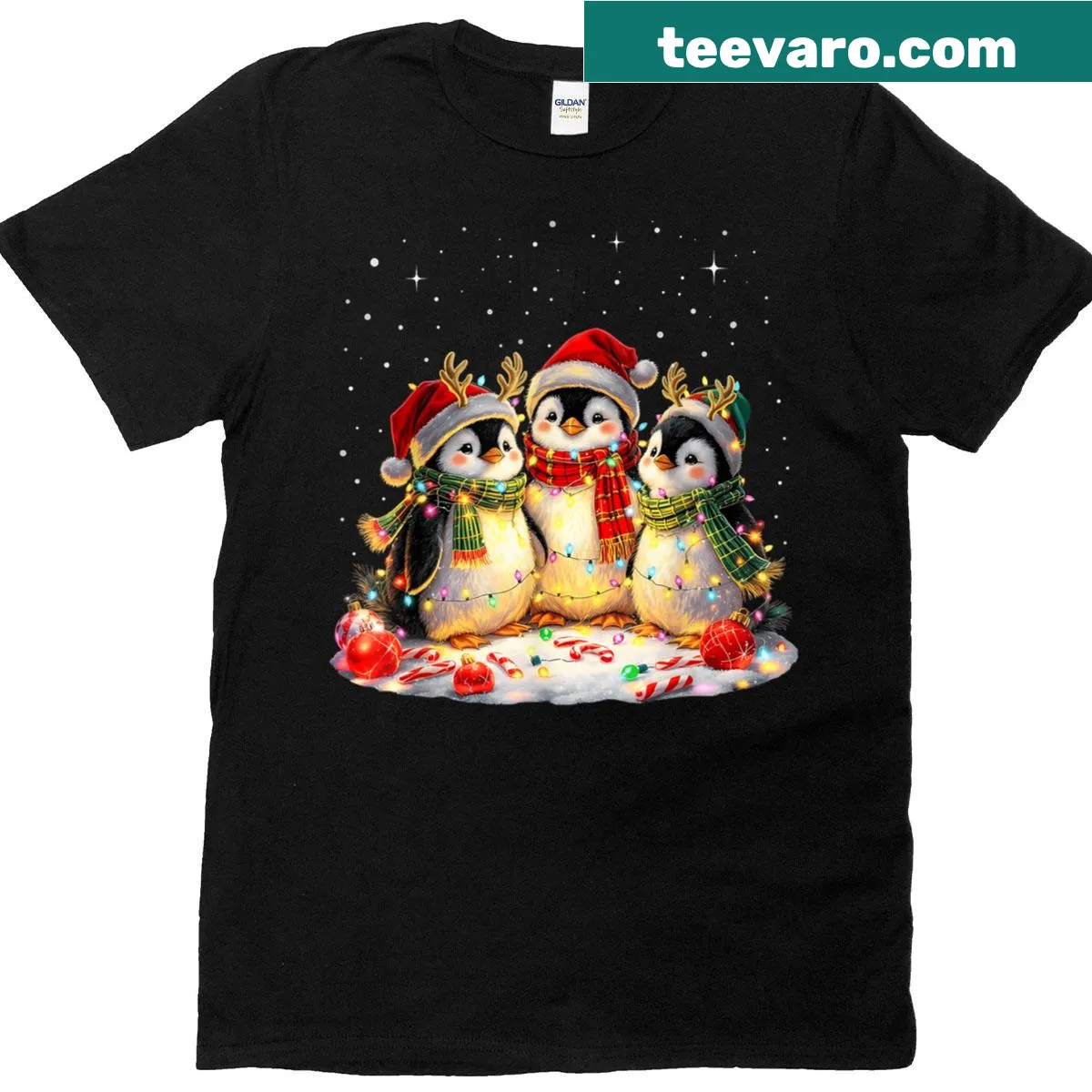 Cute penguins tangled in Christmas lights graphic T-shirt — on a men's t-shirt