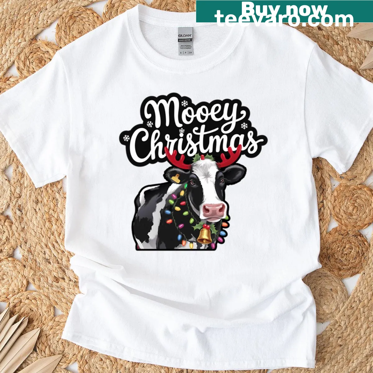 Cartoon cow in Christmas attire on a playful T-shirt — on a men's t-shirt