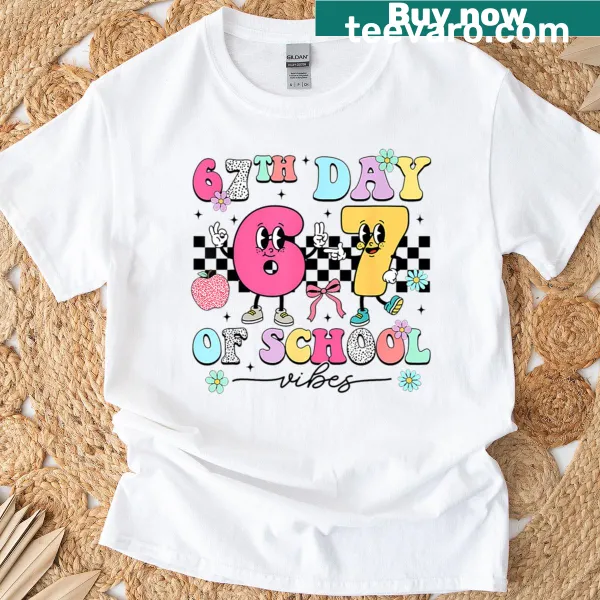 T-shirt celebrating the 100th day of school with a smile face graphic.