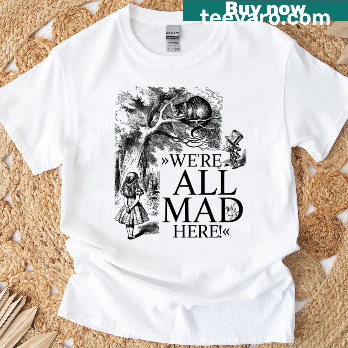 Whimsical Alice in Wonderland t-shirt with We're All Mad Here text — on a men's t-shirt