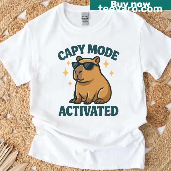 Illustrated oversized T-shirt with a capybara in sunglasses and text 'Capy Mode Activated'