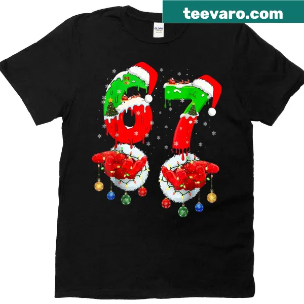 Santa hand graphic with '67' text on Christmas-themed tee
