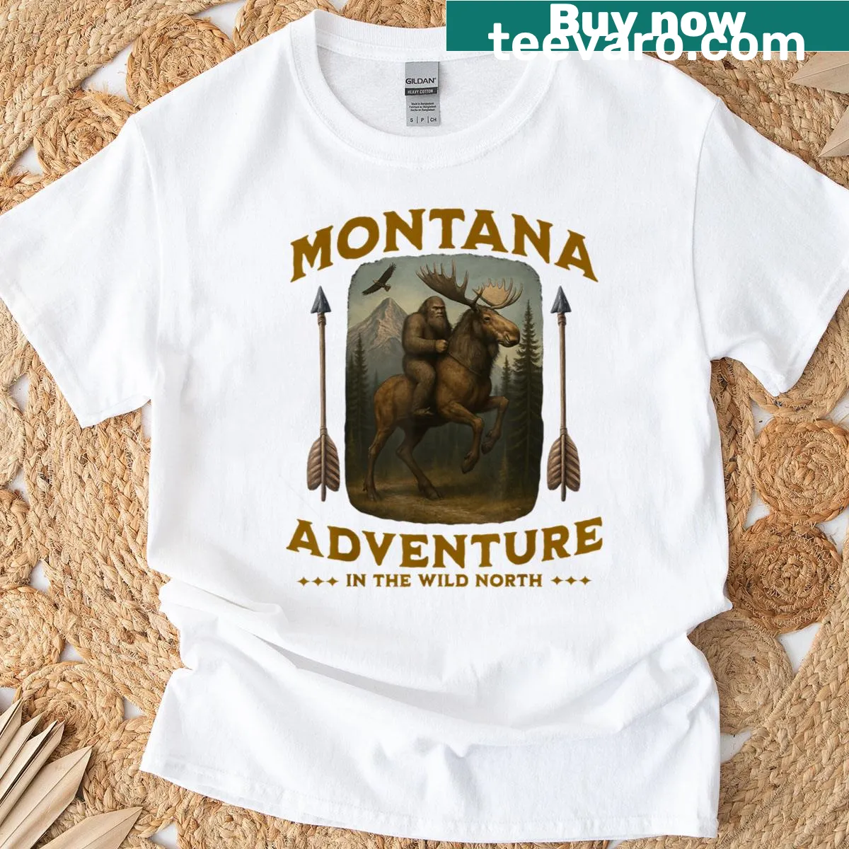 Funny graphic of Bigfoot riding a moose in Montana. — on a men's t-shirt