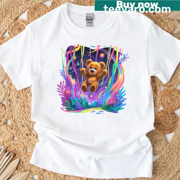 T-shirt featuring a teddy bear swinging in a magical forest setting