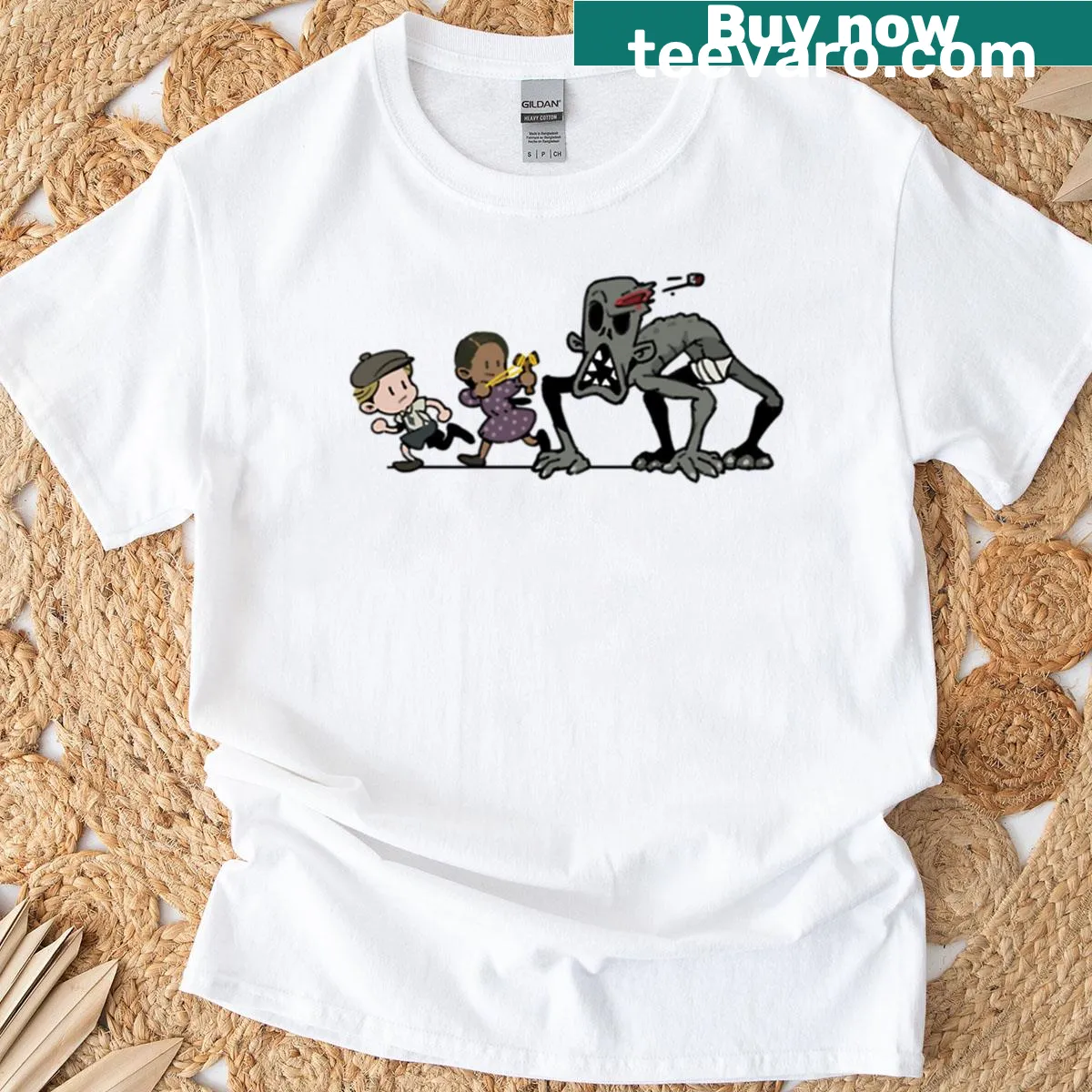 Playful cartoon design of a boygirl facing a monster on a T-shirt — on a men's t-shirt