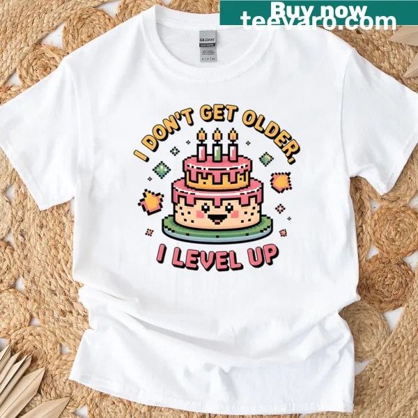 T-shirt with pixel cake graphic and text 'I Don't Get Older I Level Up'