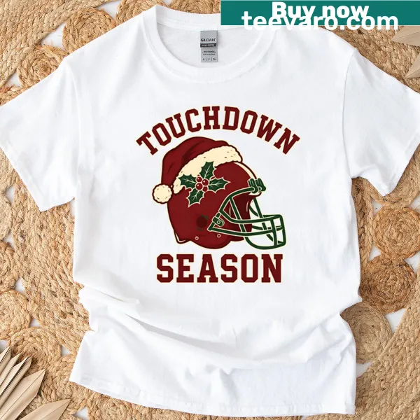 Christmas-themed football helmet graphic t-shirt.