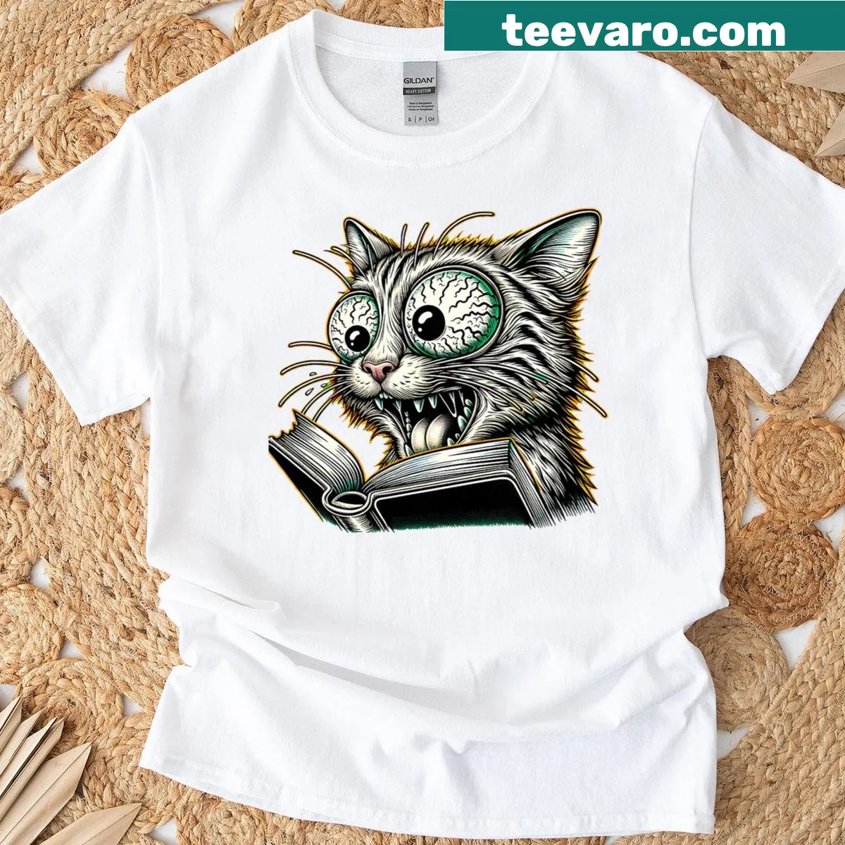 Whimsical illustration of a cat reading a book on a T-shirt — on a men's t-shirt