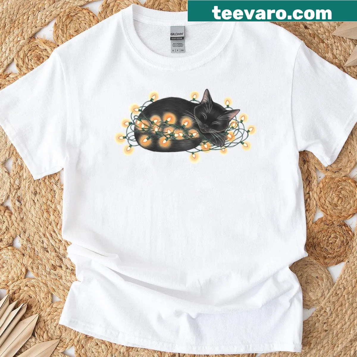 Watercolor of a sleeping black cat surrounded by Christmas lights — on a men's t-shirt
