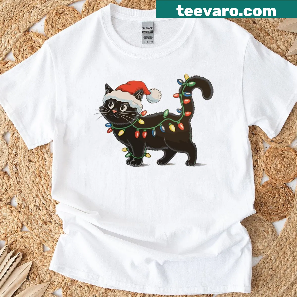 Cute black cat in Santa hat tangled in Christmas lights — on a men's t-shirt