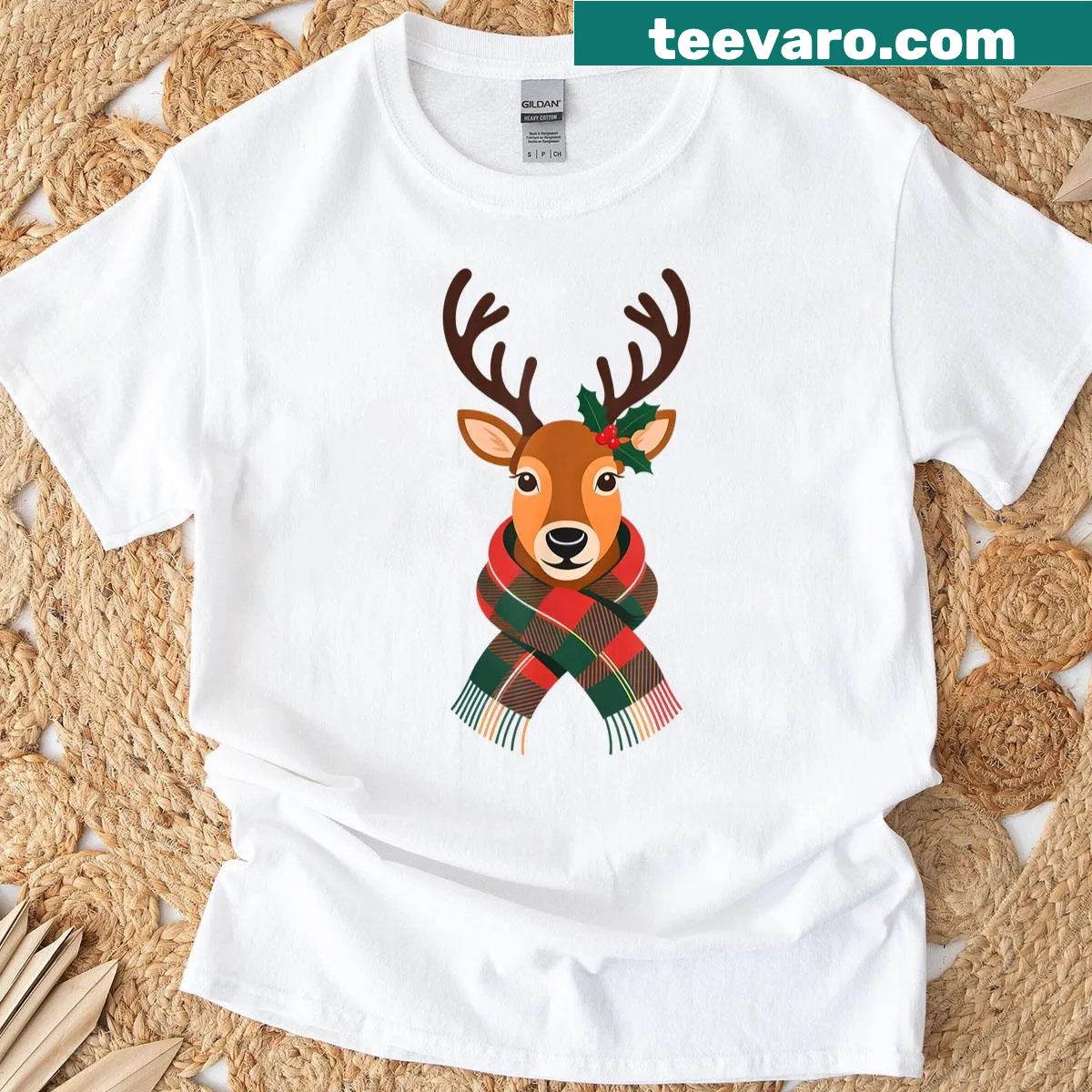 Adorable T-shirt featuring a reindeer in a plaid scarf with holly — on a men's t-shirt