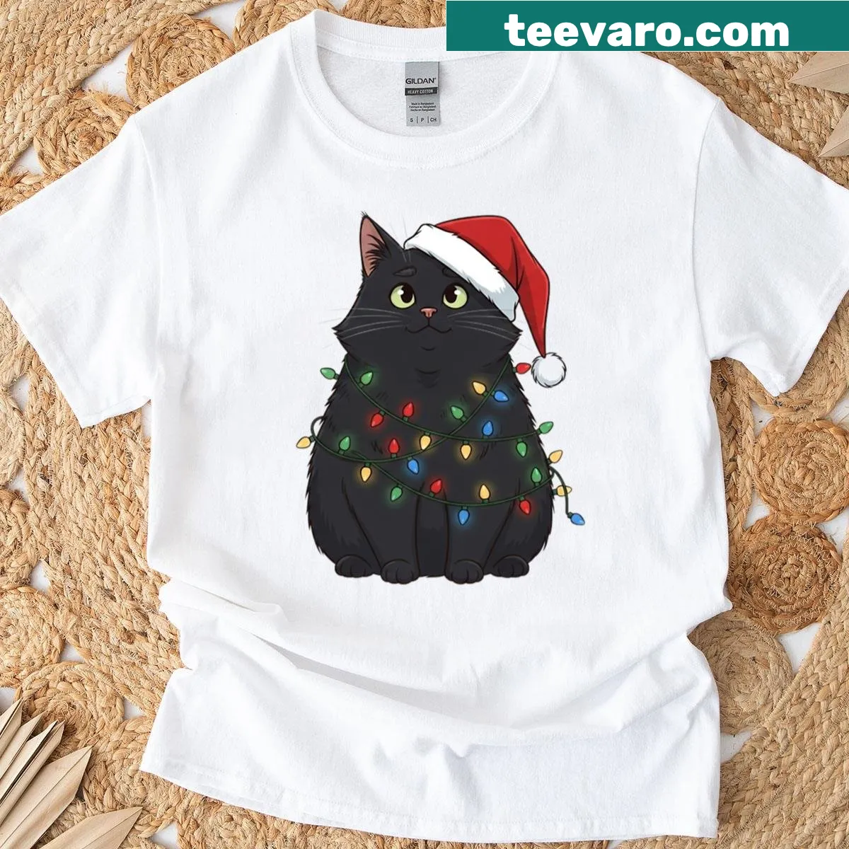 Chubby black cat in Santa hat tangled in lights t-shirt — on a men's t-shirt