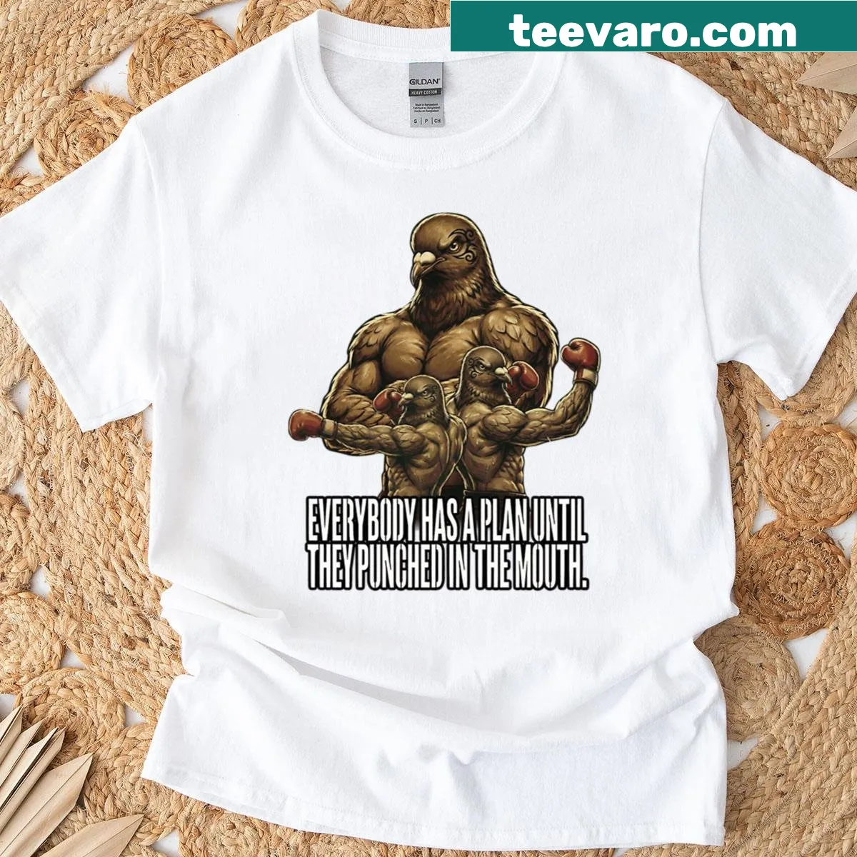 Funny boxing T-shirt with 'Everyone Has A Plan Until They Get Punched' text — on a men's t-shirt