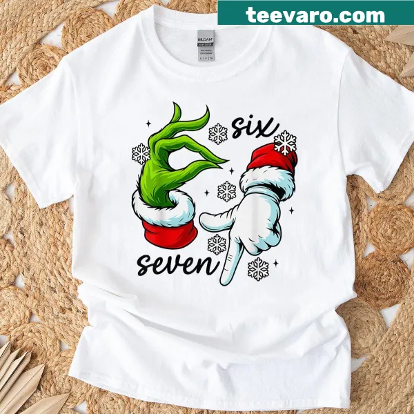 Funny Christmas T-shirt featuring an elf hand and the 67 meme