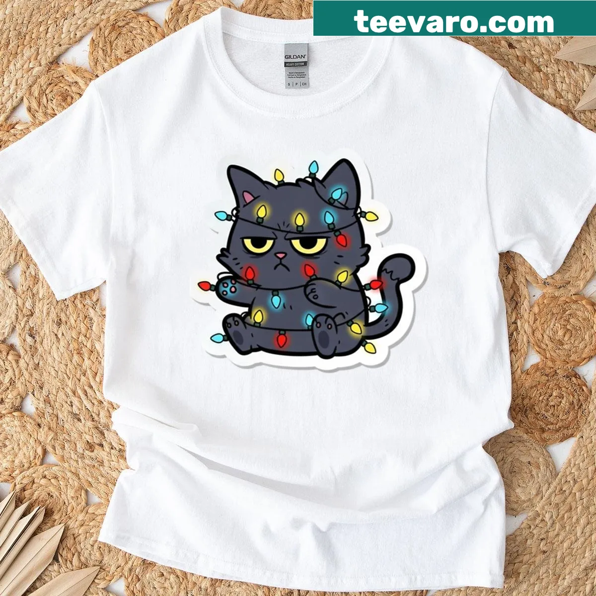 Cartoon grumpy black cat tangled in Christmas lights — on a men's t-shirt