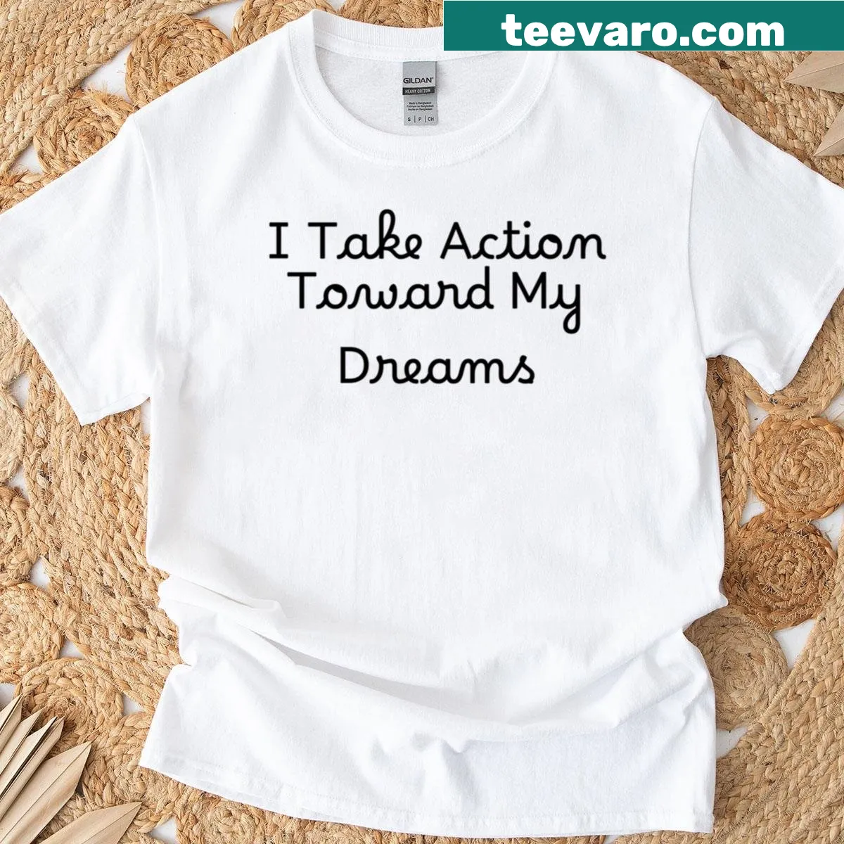 Inspirational t-shirt with text about taking action toward dreams — on a men's t-shirt