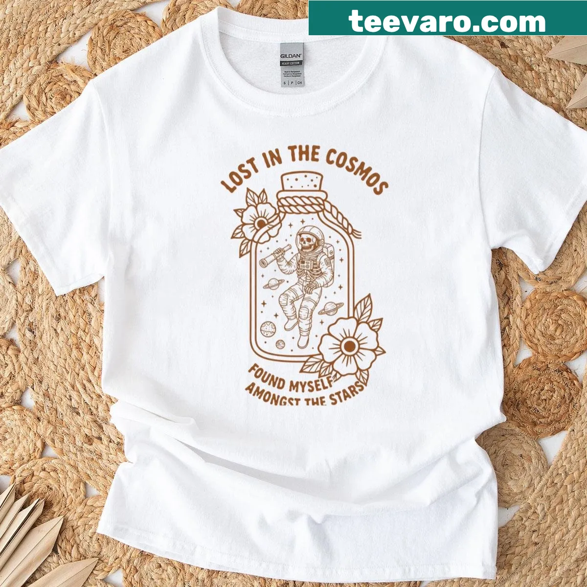 Oversized T-shirt featuring a skeleton astronaut in a cosmic bottle illustration — on a men's t-shirt