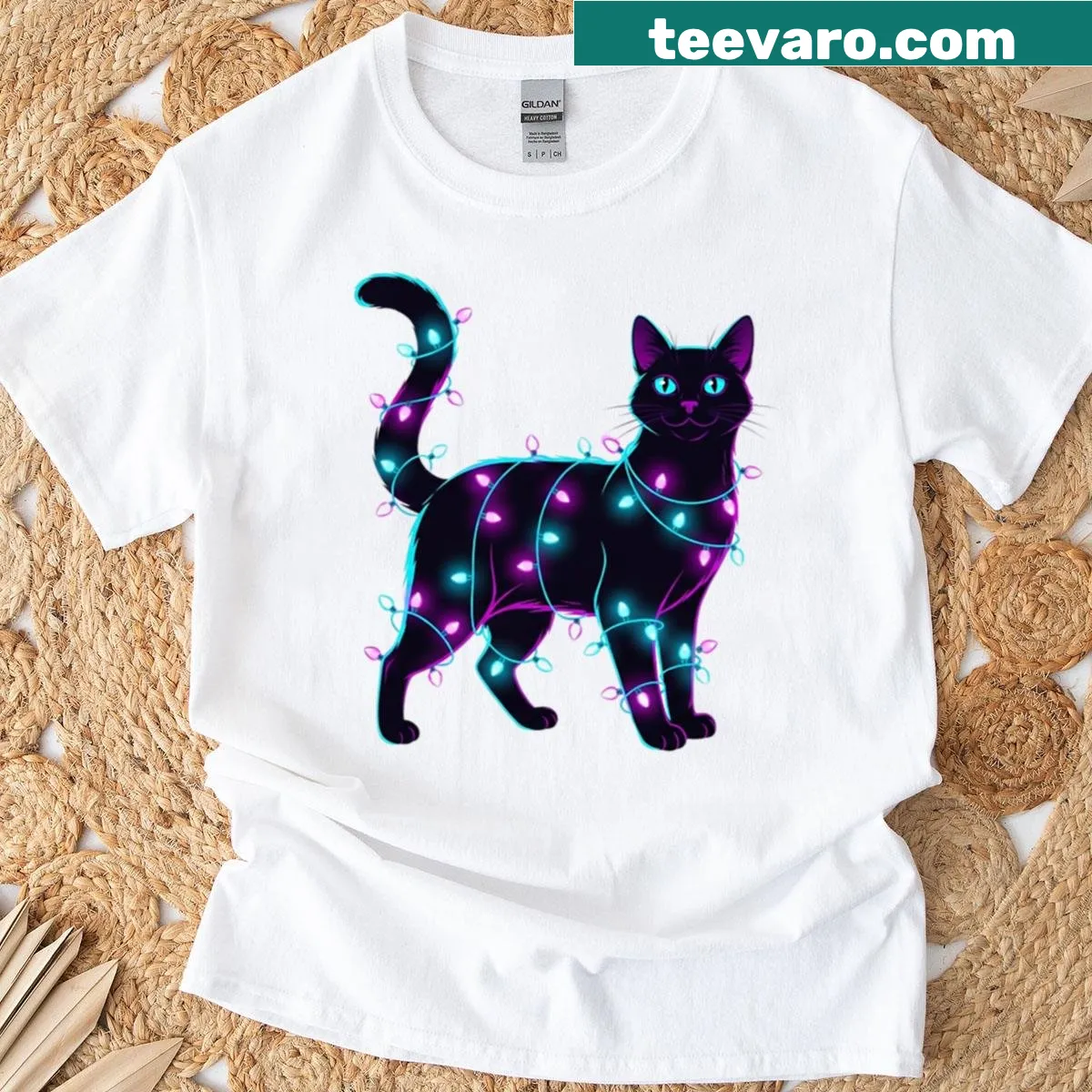 T-shirt depicting a black cat tangled in Christmas lights — on a men's t-shirt