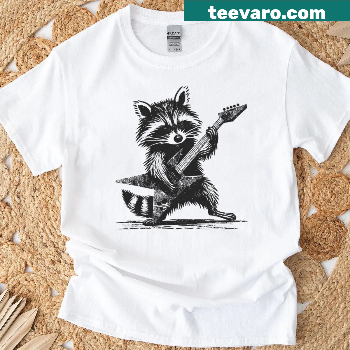 Cartoon raccoon rocking out on a music-themed T-shirt — on a men's t-shirt