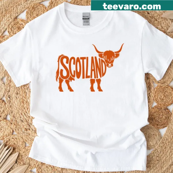 Cartoon Highland cow graphic on a souvenir Scottish T-shirt.