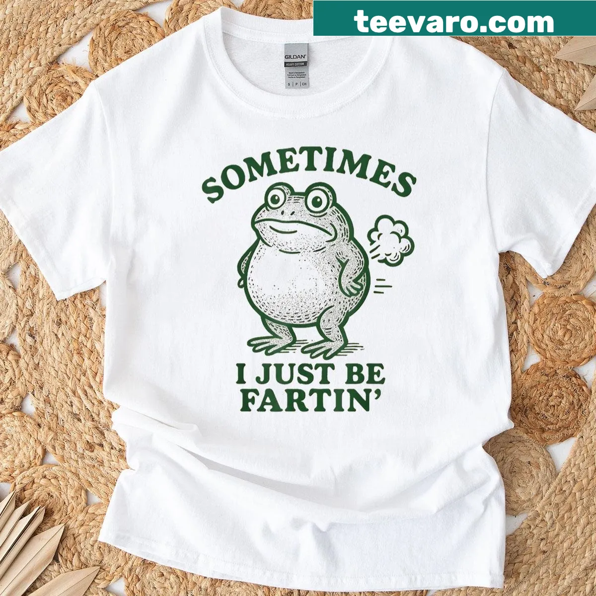 Playful cartoon frog with humorous farting phrase graphic on t-shirt — on a men's t-shirt