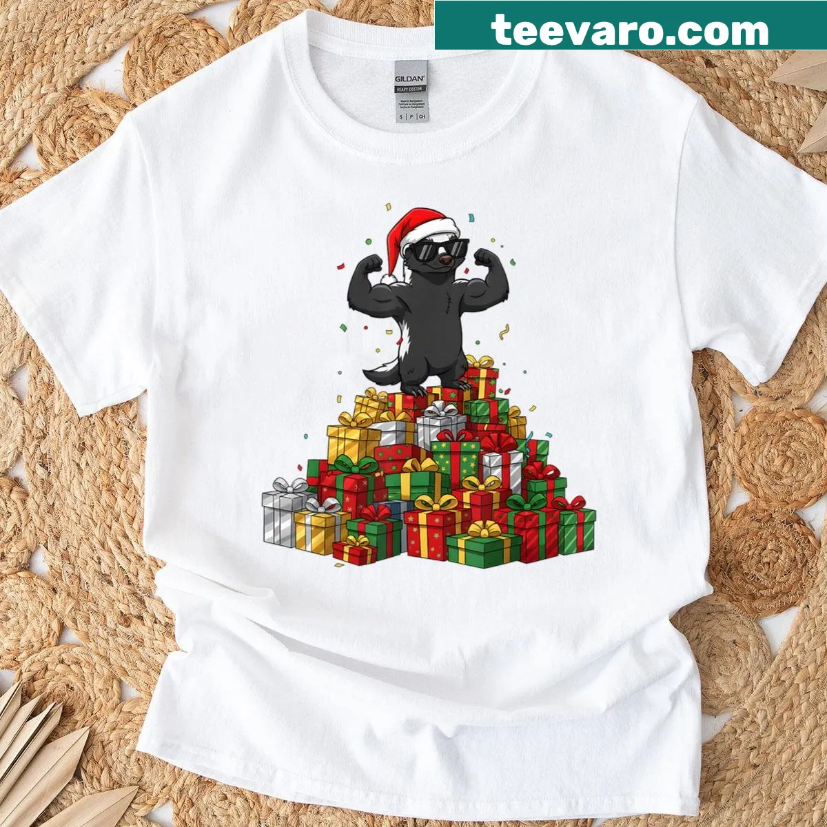 Honey badger surrounded by Christmas presents graphic t-shirt. — on a men's t-shirt