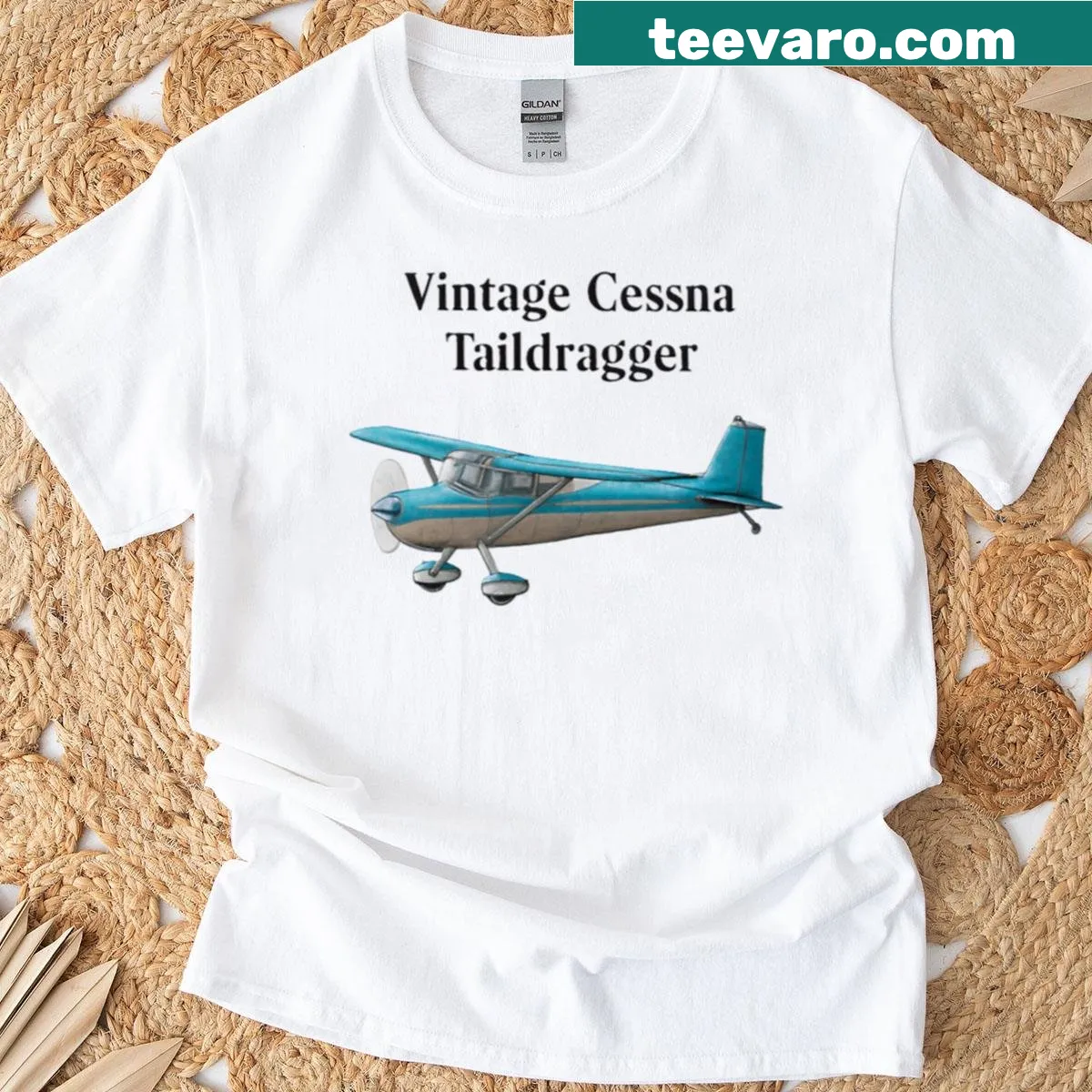 Illustrated T-shirt featuring a vintage Cessna taildragger and polished metal details — on a men's t-shirt