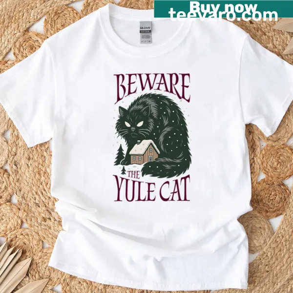 Whimsical Yule Cat graphic t-shirt celebrating holiday folklore.