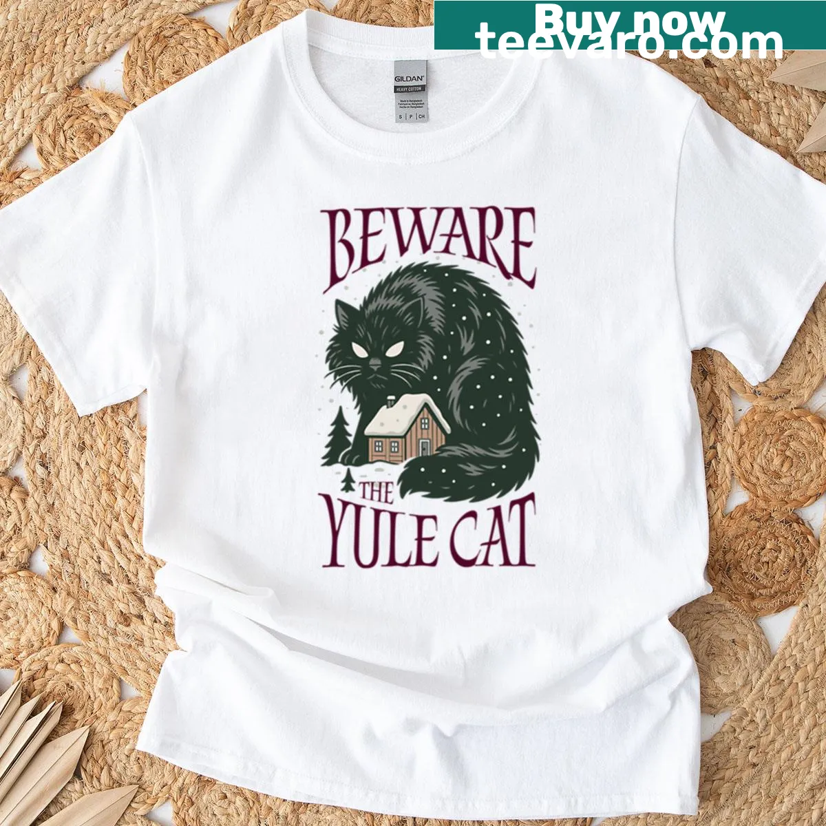 Whimsical Yule Cat graphic t-shirt celebrating holiday folklore. — on a men's t-shirt