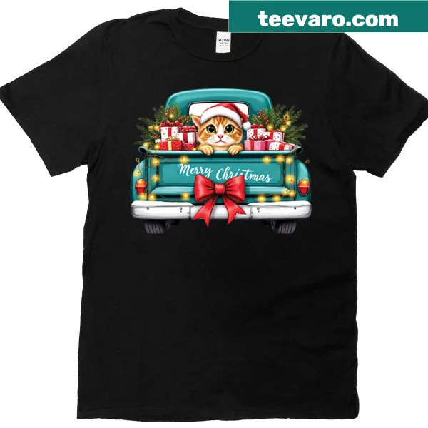 Teal Christmas truck t-shirt featuring a playful cat illustration