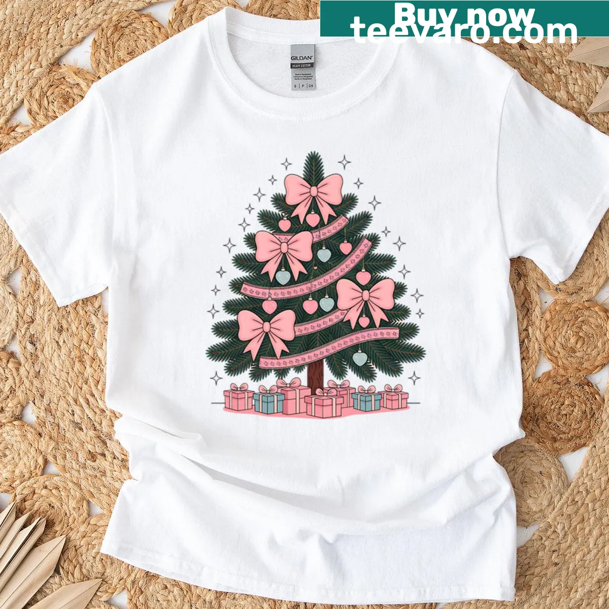 Cute Christmas T-shirt featuring a tree with pink bows — on a men's t-shirt
