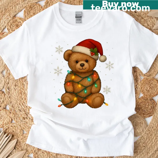 T-shirt featuring a teddy bear with Christmas lights and Santa hat